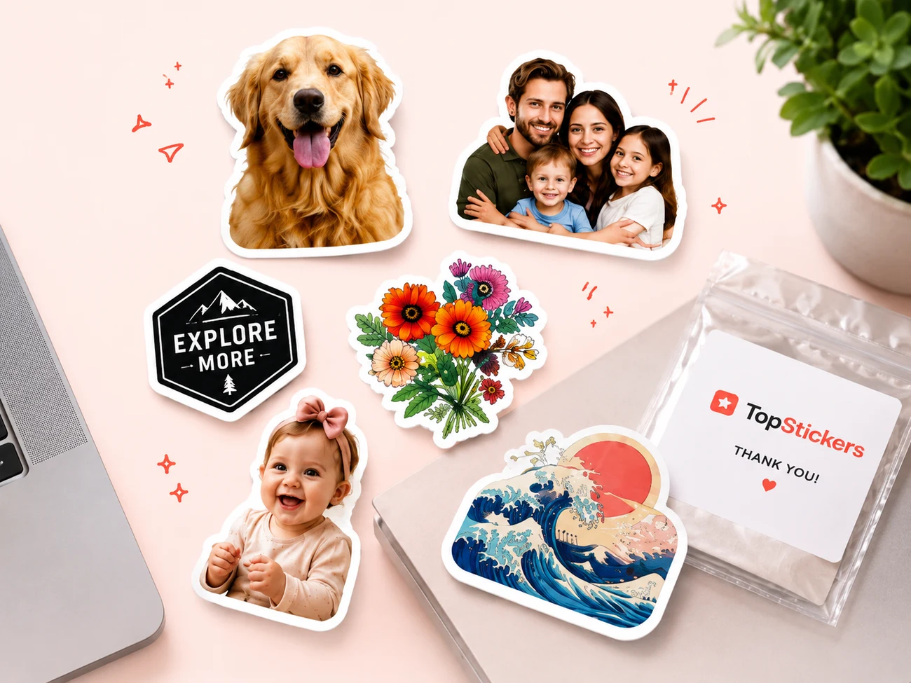 Finished custom stickers made from photos — a dog, a family, a logo, flowers, a baby and a wave — on a desk with a TopStickers pouch